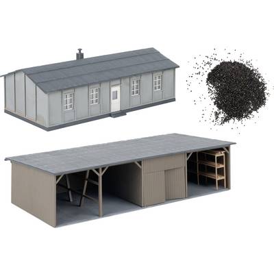 Two 3D building models shown above and below, with a pile of black granules at upper right; the lower building is an open-sided shed with shelving.