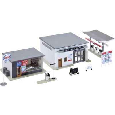Miniature model of an Esso gas station with a service garage, main building, and fuel pump canopy, shown as a scale diorama.