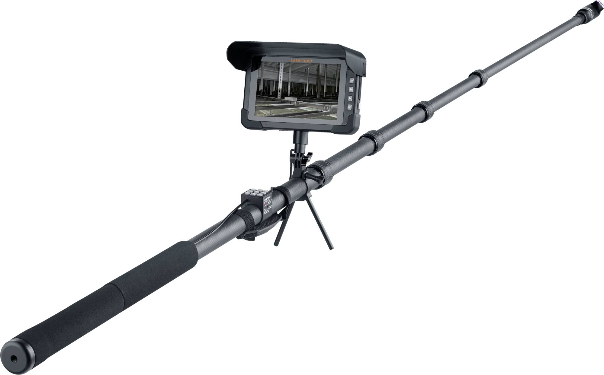 Long-range inspection camera on a telescoping pole with grip handle and tripod stand, showing a monitor previewing an indoor construction site.