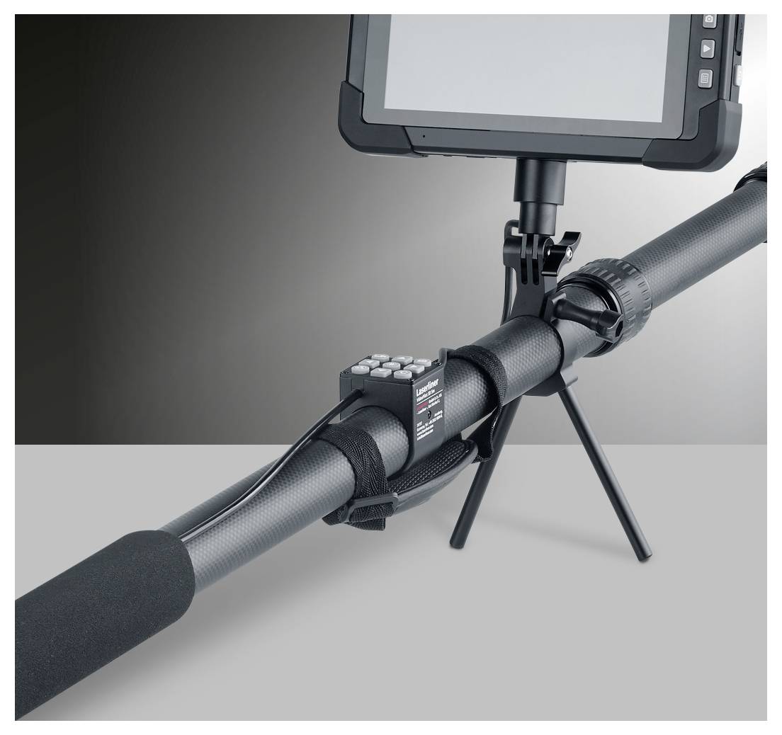 A camera-mounted monitoring device on a tripod attached to a cylindrical pipe, with a foam-covered microphone-like end and control box.<br>