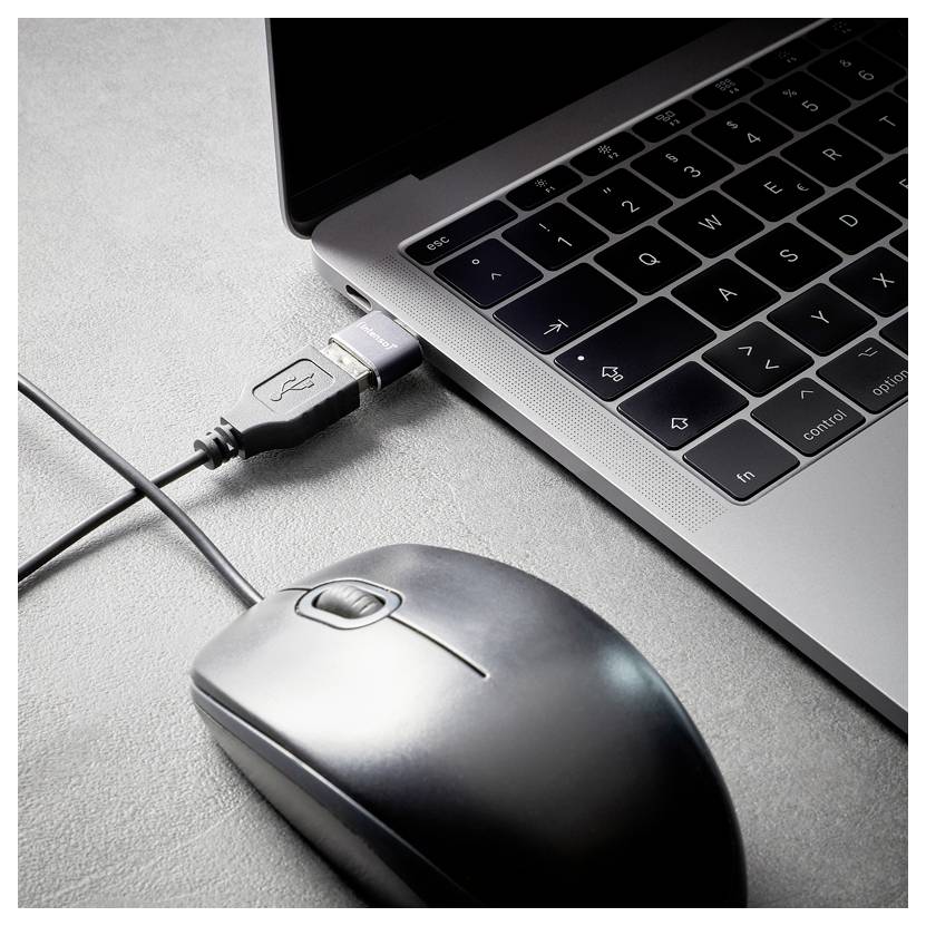 Laptop connected by USB cable next to a wired mouse on a desk.<br>