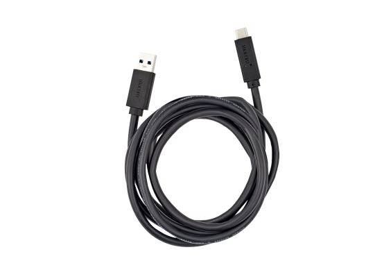 Coiled black USB-A to micro-USB charging cable on a white background.