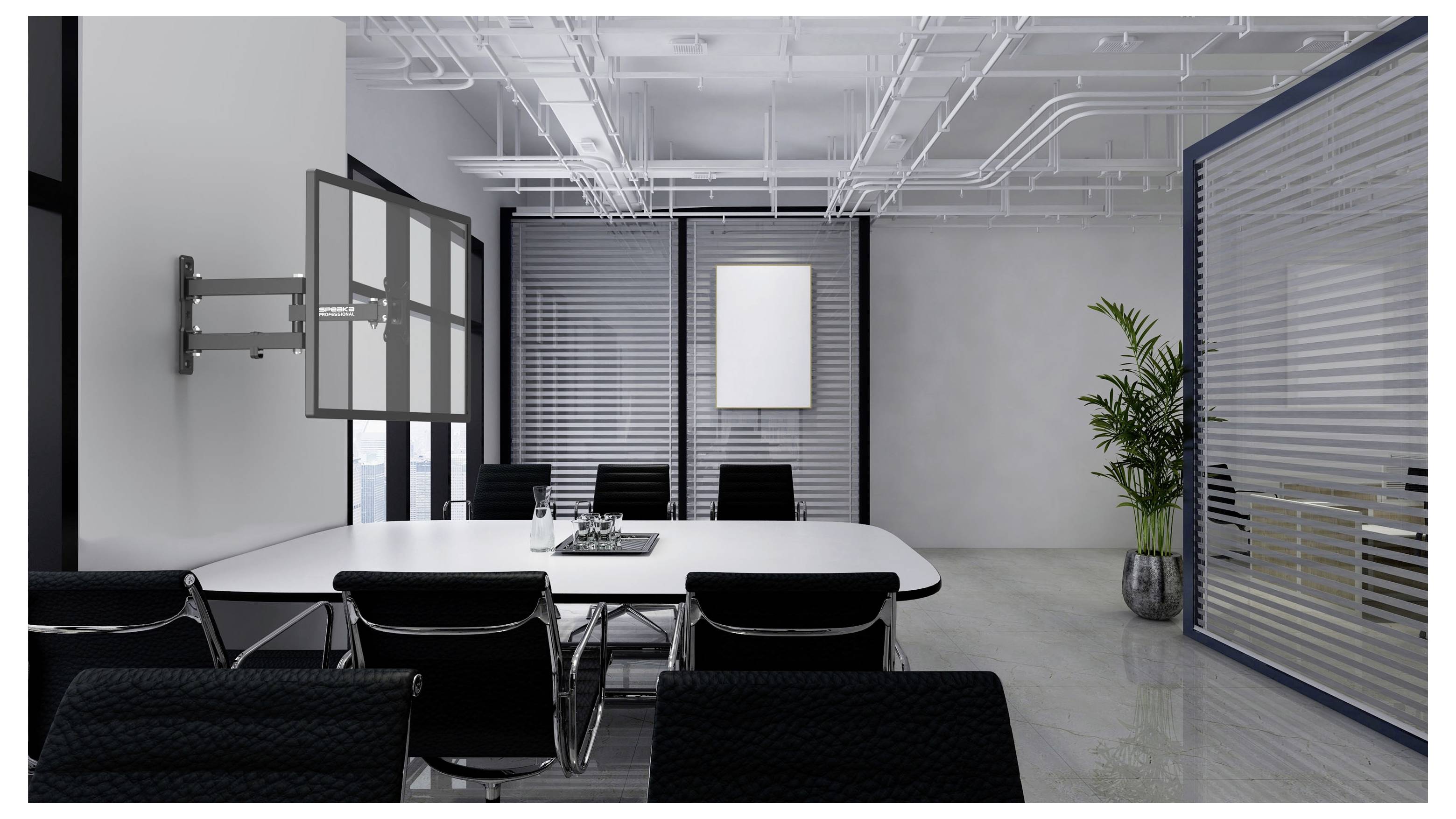 Modern conference room with a long white table, black chairs, wall-mounted display arm, blinds, and a potted plant.