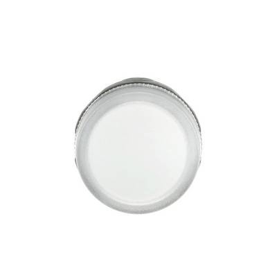 Close-up of a round white plastic cap or lid on a plain background.