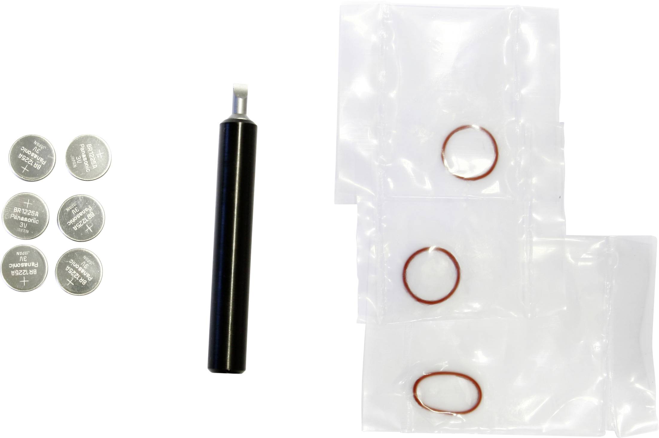 Assorted small parts laid out on white: six silver coin batteries, a black cylindrical tool, and three clear plastic bags with red rubber O-rings.