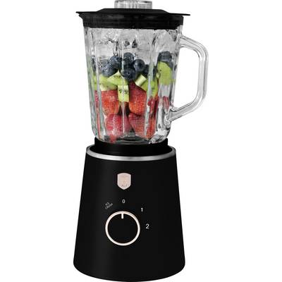 A countertop blender filled with strawberries, blueberries, and grapes, showing the pitcher and simple speed dial on a black base.