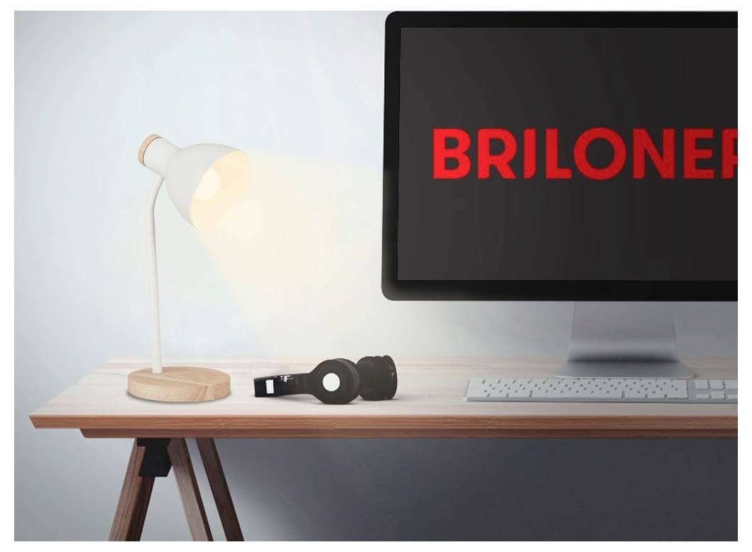 Desk scene with a lamp, headphones, keyboard, and monitor displaying the red word 'BRILLONE'.