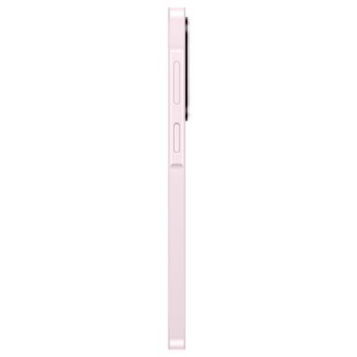 Close-up of a pink smartphone side edge with the volume button and mute switch visible.
