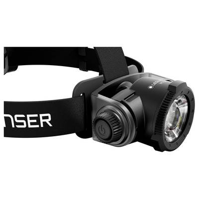 Black adjustable headlamp with LED light and power button on a strap, shown in close-up on a white background.