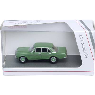 Green vintage toy car in a display box labeled 'Edition 1:87'.