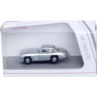 Silver model car in a display box labeled 'Edition 1:87' with a clear plastic window.