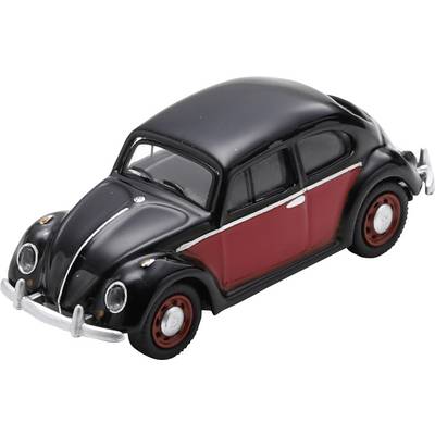 Toy black and red vintage Volkswagen Beetle car model on a white background.