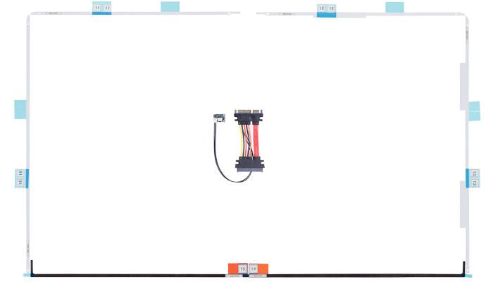 A mostly blank white background with a small central wiring harness or cable assembly mounted vertically in the middle.
