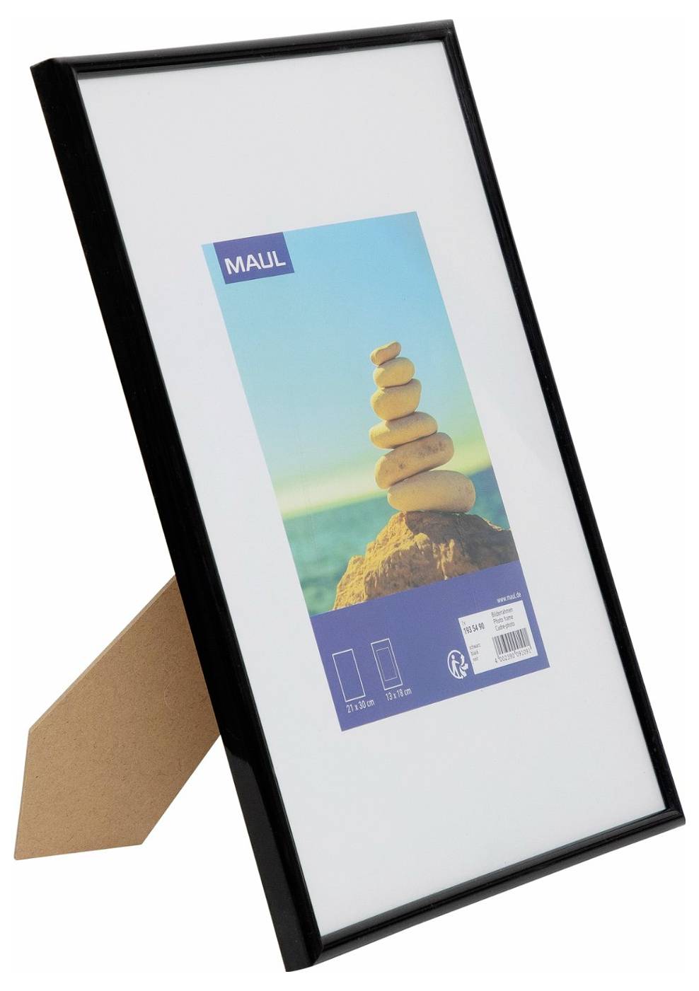 Black-framed picture frame with a white mat and sample photo insert of stacked stones on a beach, shown in packaging<br>