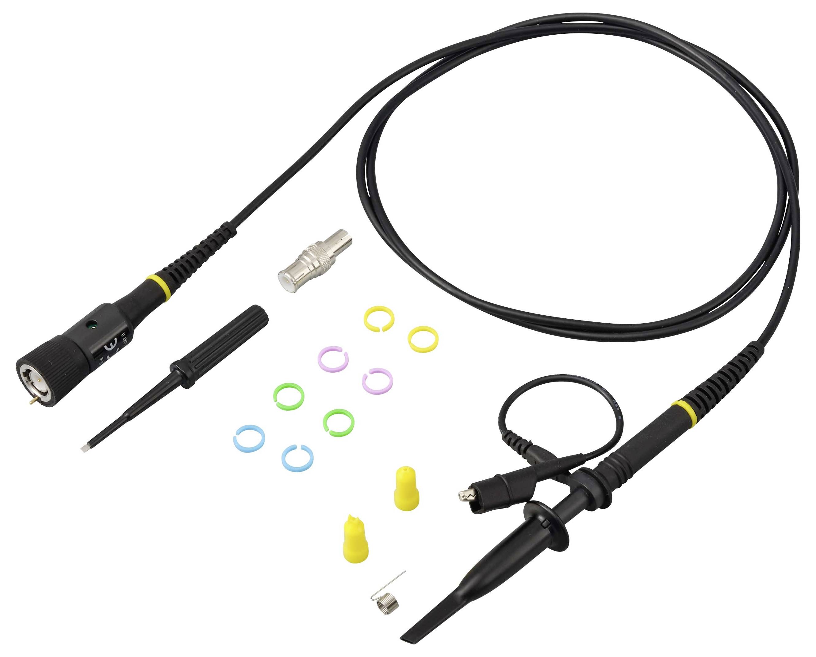Black cable accessory kit with coax-style connectors, metal adapter, small tool, and colored O-rings laid out on a white background.