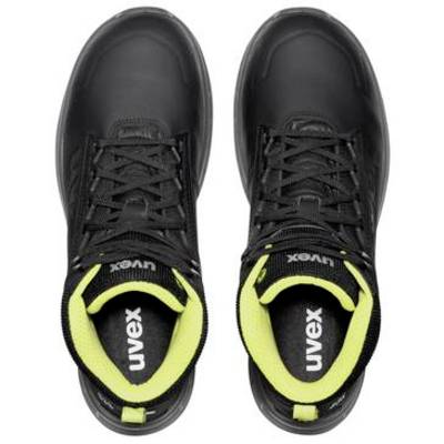 Pair of black Uvex athletic shoes with lime green collars, shown from above on a white background.