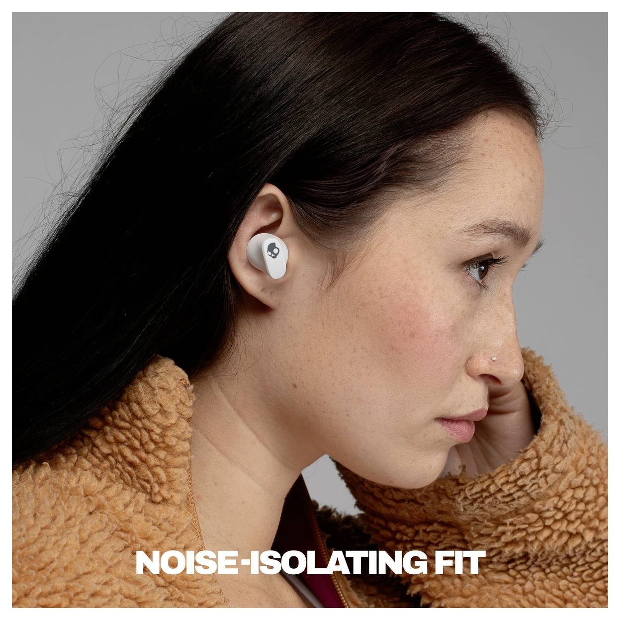 Woman wearing a white earbud in profile, with the caption 'NOISE-ISOLATING FIT' at the bottom.