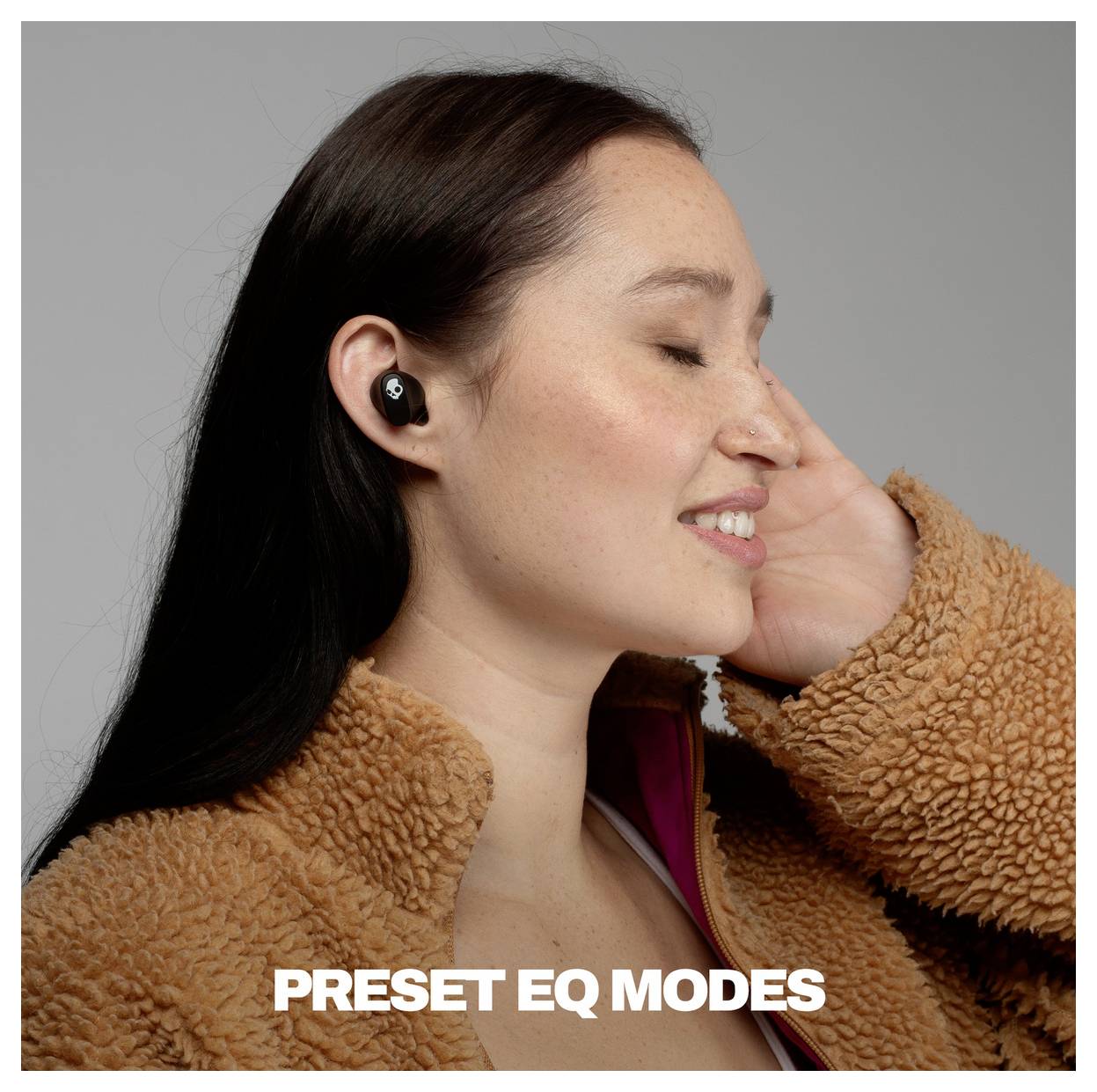Woman wearing a wireless earbud adjusts it, illustrating 'PRESET EQ MODES' for audio settings.<br>