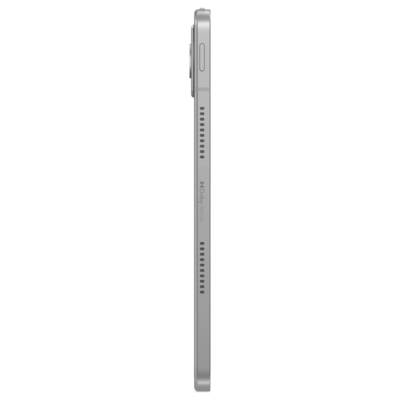 Side view of a slim silver smartwatch or fitness tracker with a round dial, side button, and perforated strap.