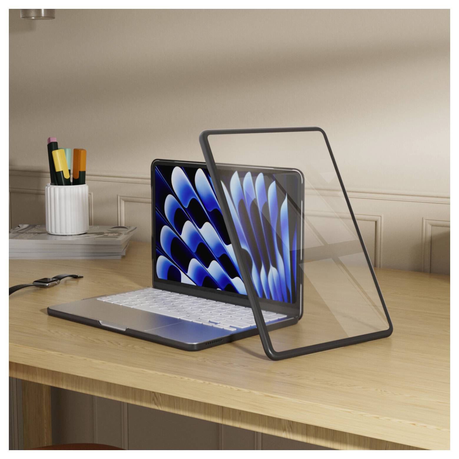 Laptop on a wooden desk with a detachable, transparent screen or case panel propped open in front of it; desk organizer in background.<br>