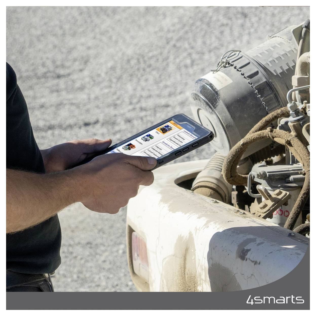 Person using a smartphone to inspect a dusty vehicle engine or machinery outdoors, with the '4smarts' logo in the corner.