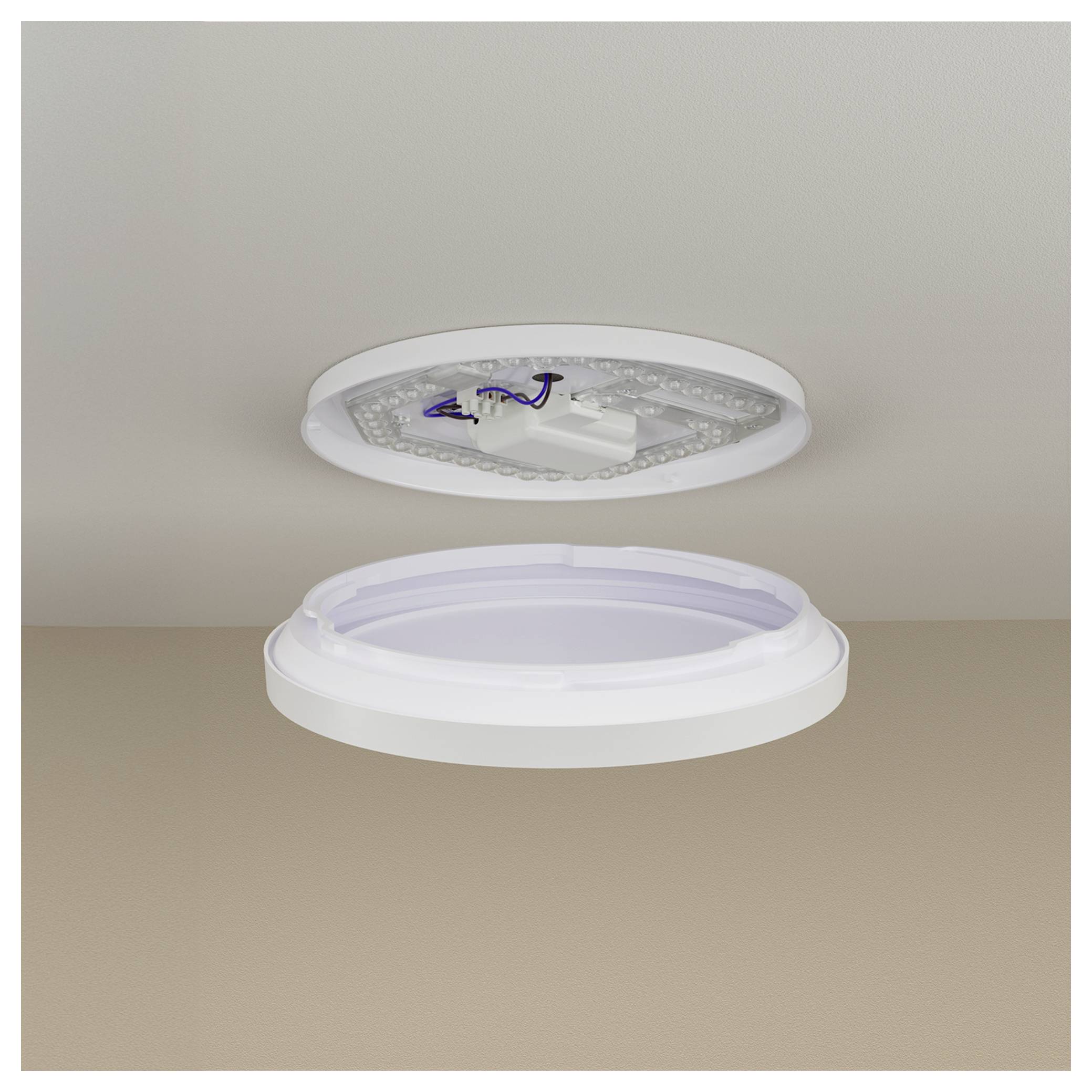 Ceiling light fixture shown exploded into two parts, with the LED module and wiring exposed above the detached diffuser ring below.