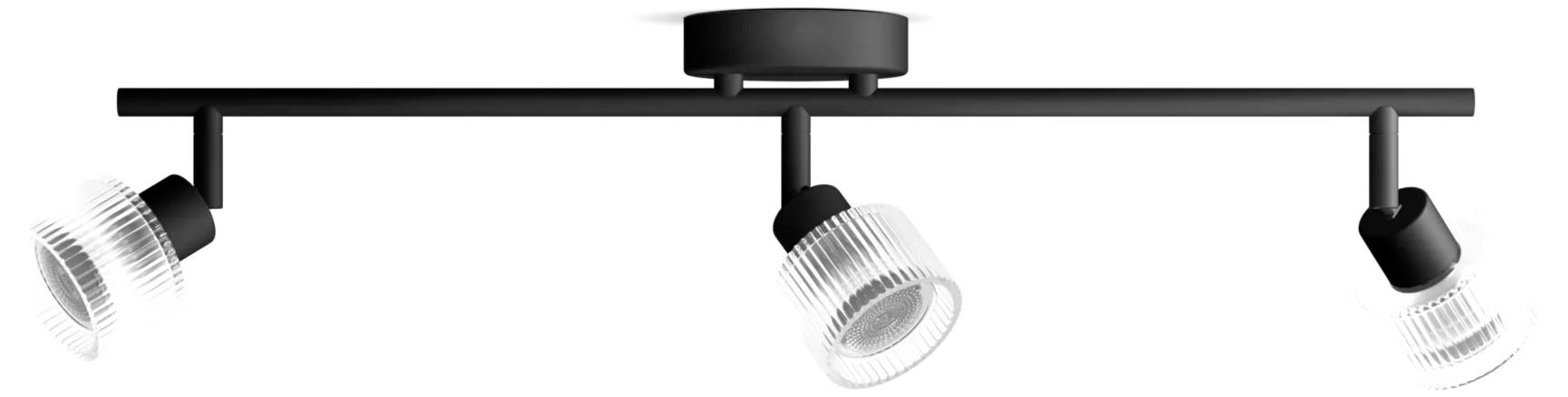Black ceiling track light bar with three adjustable spotlights, two angled outward and one hanging downward.