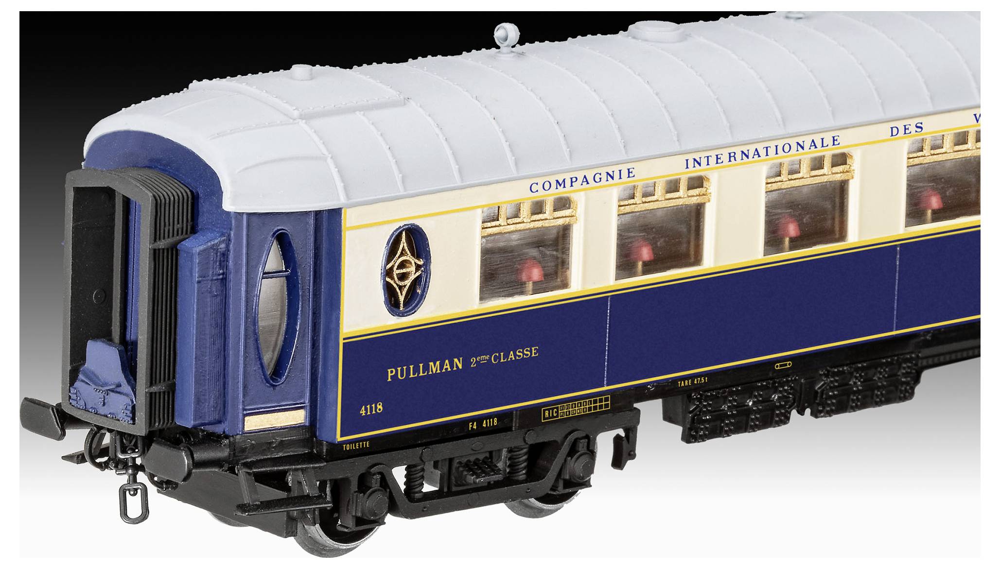 Blue and cream Pullman passenger train car model with white roof, side windows, and front end detail on a plain background.