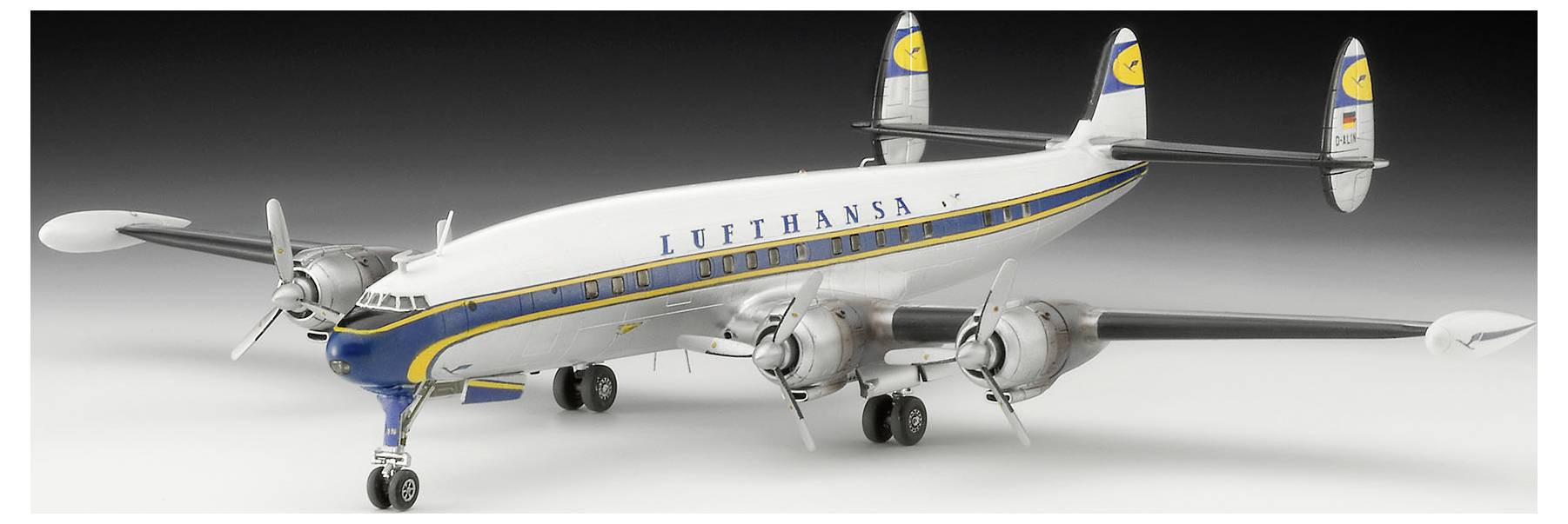 A Lufthansa vintage four-engine propeller airliner on a white studio background, shown in side view with landing gear down.