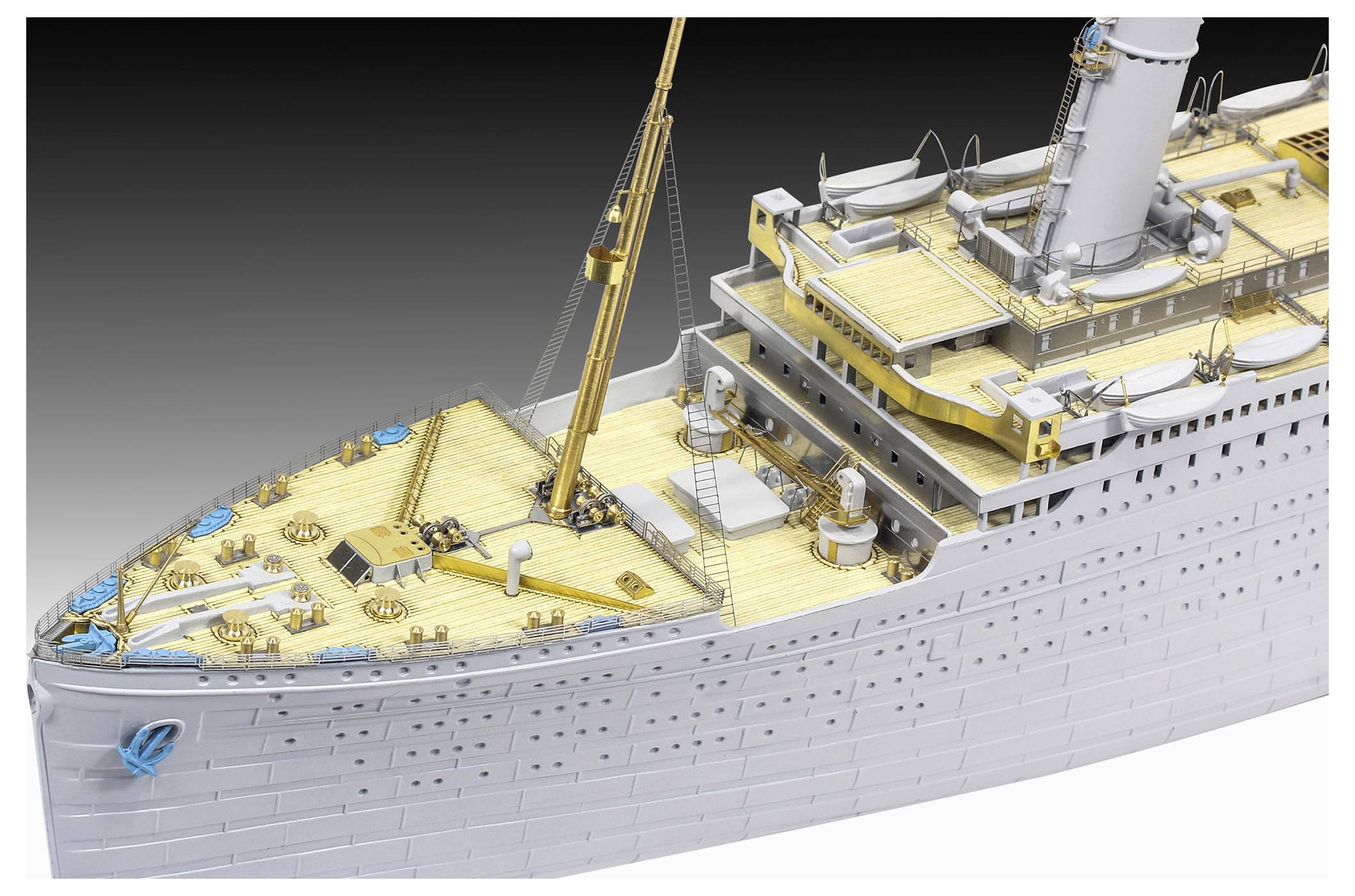 Model of a cruise ship viewed from above, showing the deck layout, smokestack, crane, and lifeboats.