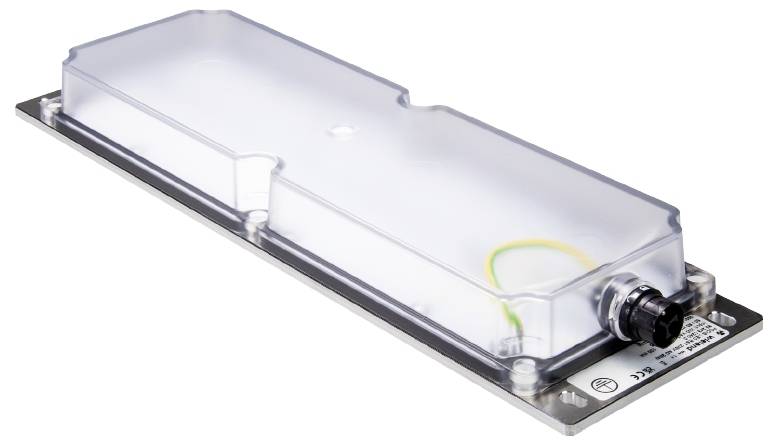 Transparent water container on a metal base plate with connection fitting, presumably a technical component or reservoir for a device.