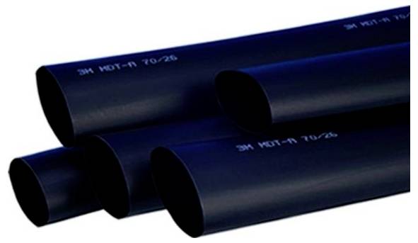 Black 3M heat-shrink tubing pieces stacked on a white background, labeled '3M HST-1 70/26'.