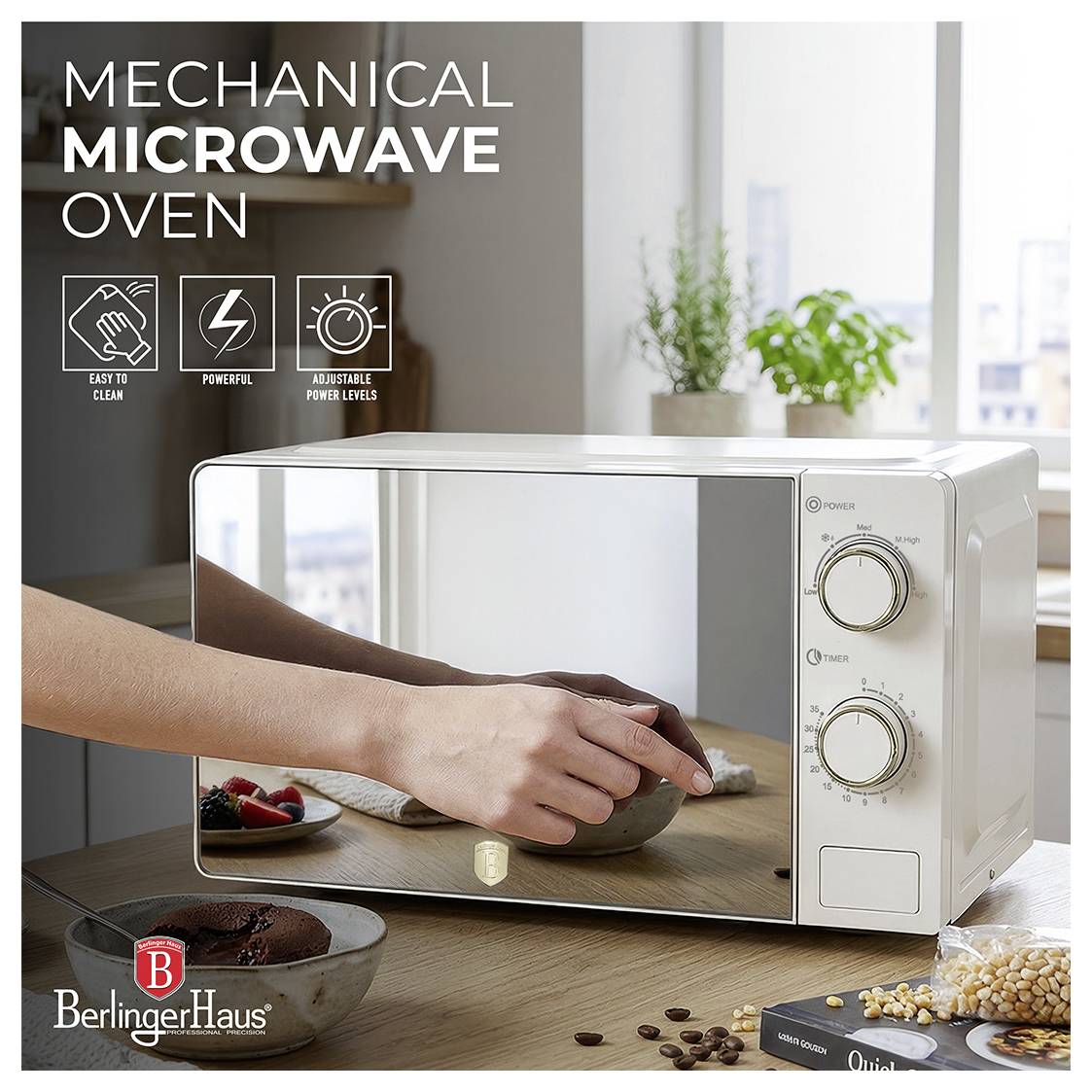 White BerlingerHaus mechanical microwave oven on a kitchen counter, shown with a hand opening the door; text highlights 'Easy to clean', 'Powerful', and 'Adjustable power levels'.<br>