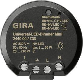 GIRA universal LED dimmer module with labeled terminals and voltage/power specifications printed on the front.