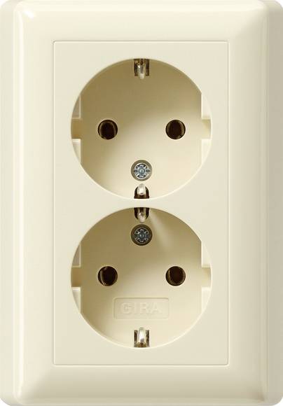 Cream-colored dual electrical wall outlet with two round socket openings.