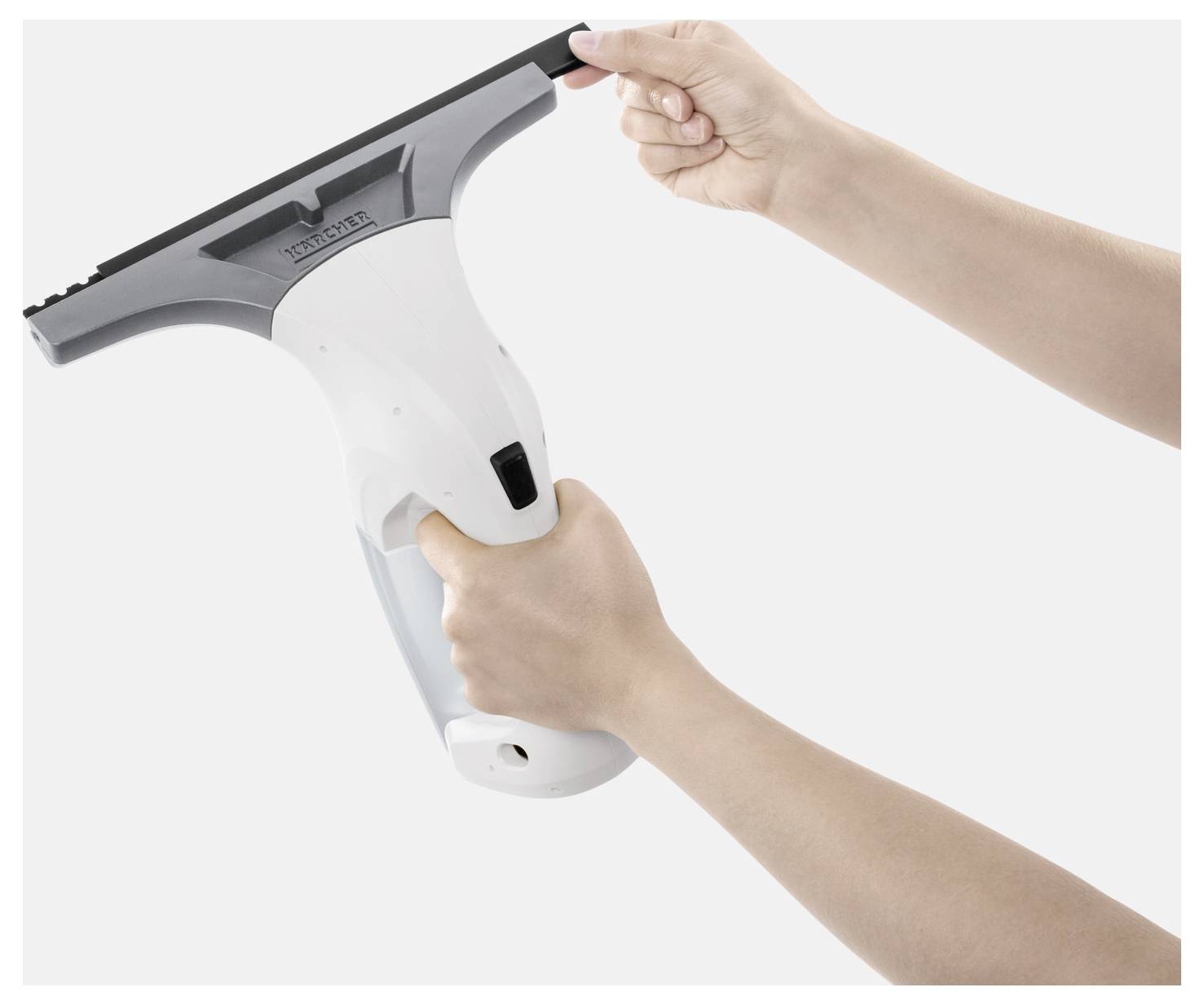 Hands holding a window squeegee, cleaning tool with black blade and white handle on a white background.