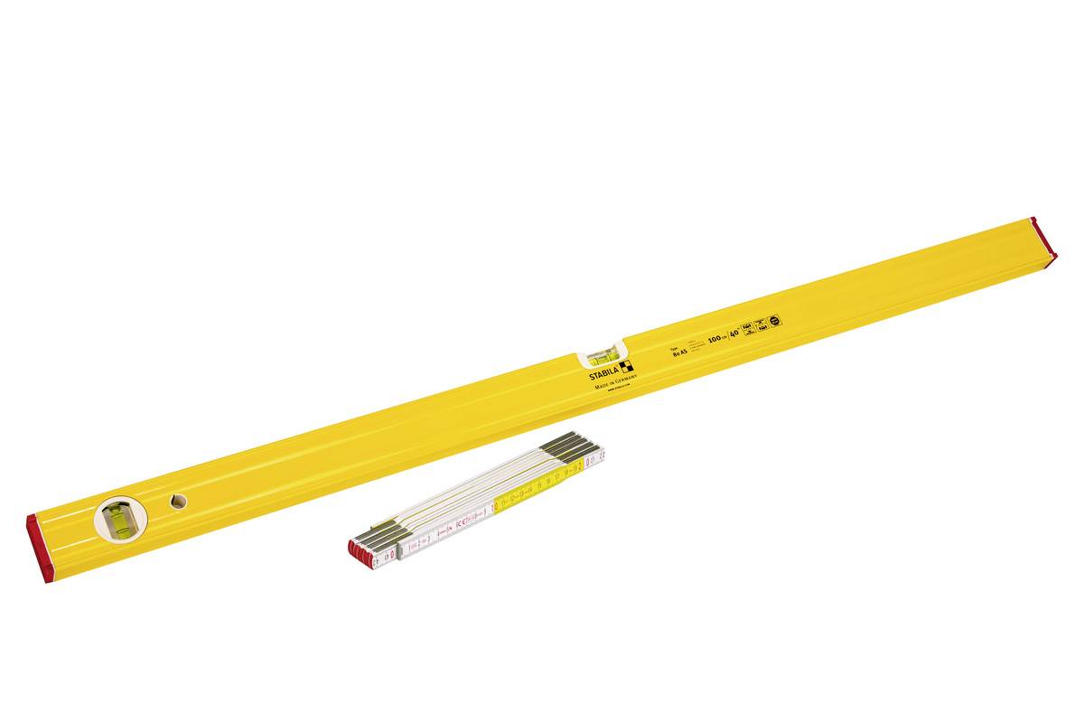 Yellow spirit level with one bubble vial and a smaller folding ruler underneath on a white background.