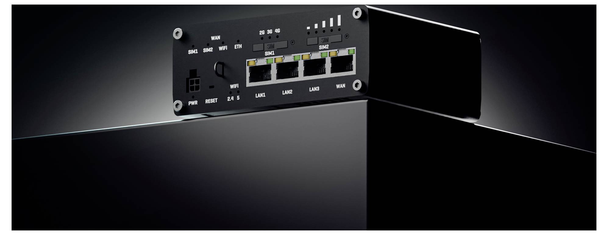 Black network device front panel with ports, LEDs, and labeled status indicators, shown in a sleek side view on a dark background.