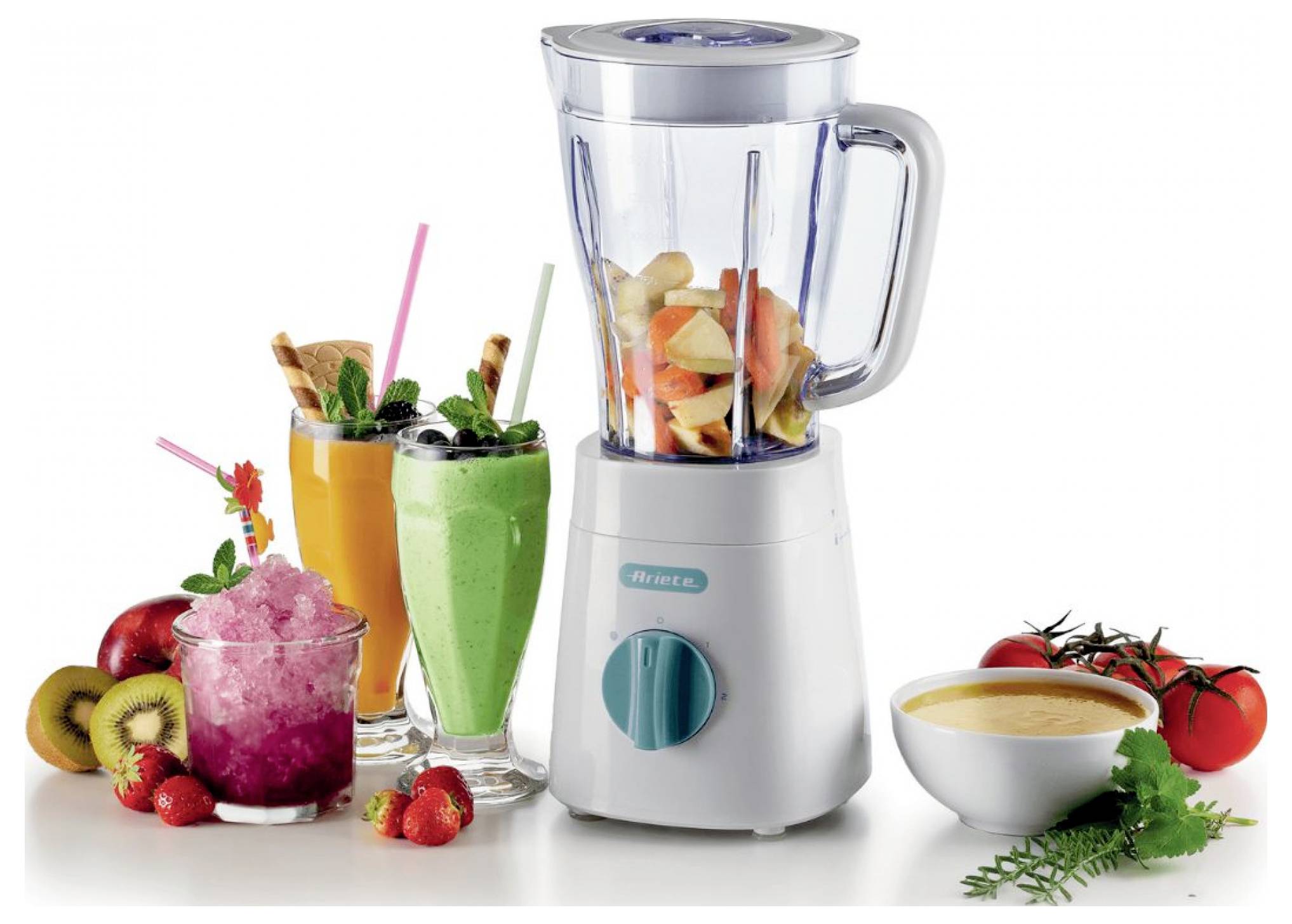 Countertop blender with fruit and vegetables inside, surrounded by prepared smoothies and fresh ingredients, suggesting blending for drinks or soup.