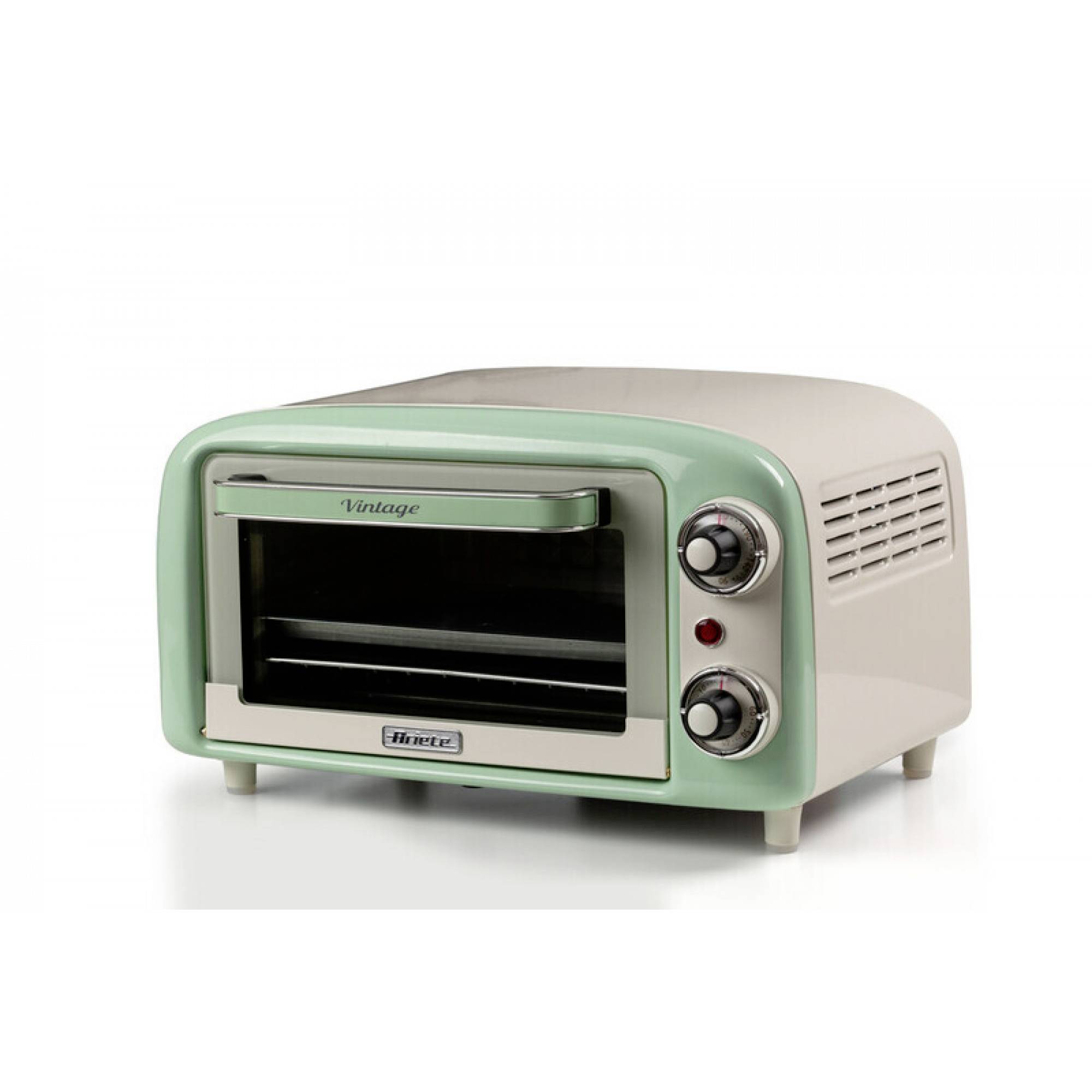 Vintage mint green countertop toaster oven with two control knobs and a front glass door on a white background