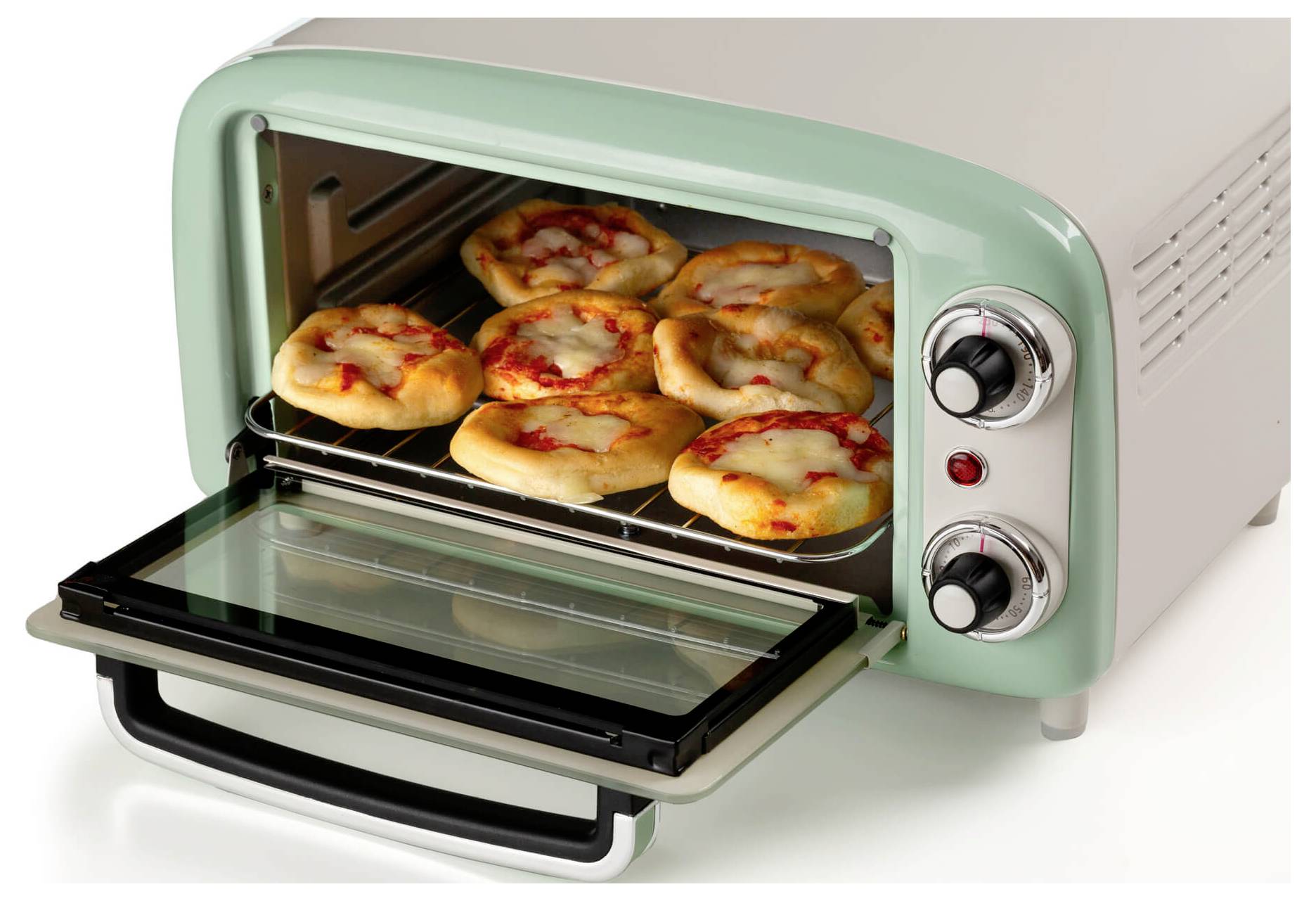 Open countertop toaster oven with a tray of small pizzas baking inside and the glass door lowered open.