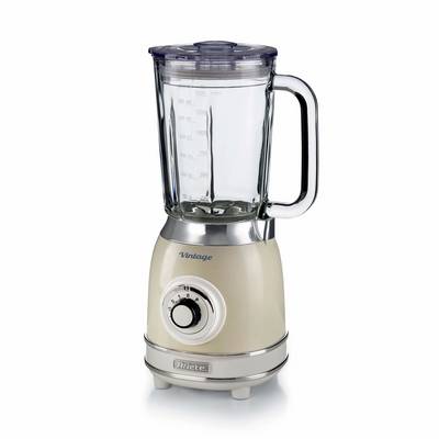 A beige countertop blender with a clear glass pitcher, lid, handle, and front control dial on a white background.