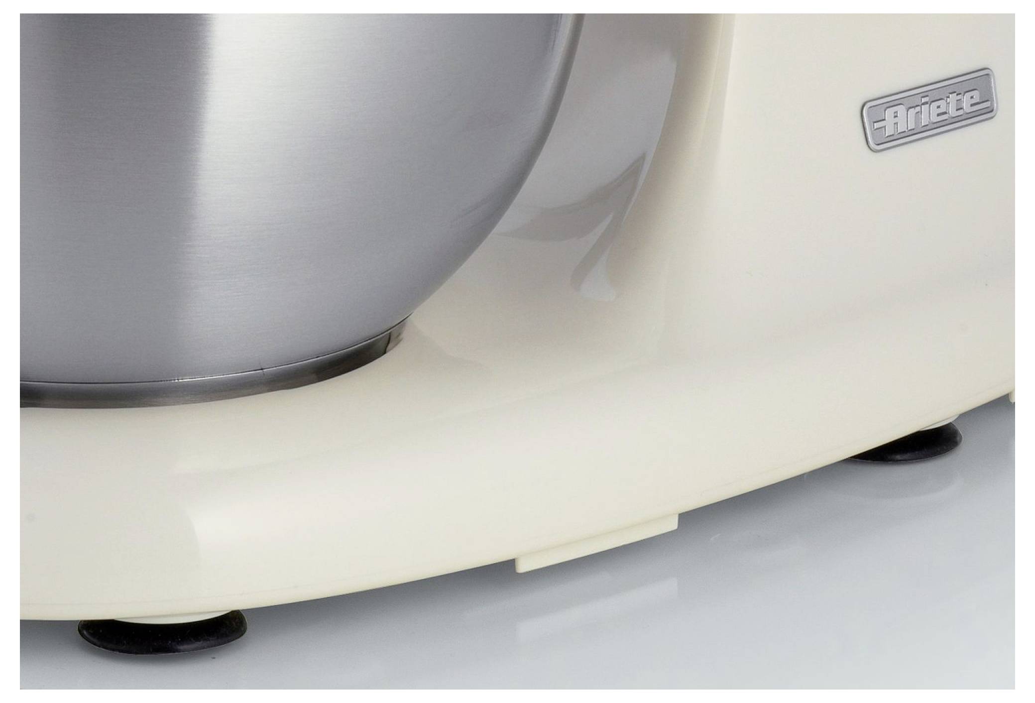 Close-up of a cream-colored Ariete appliance base with a metal bowl, showing the brand logo and suction feet on a countertop.
