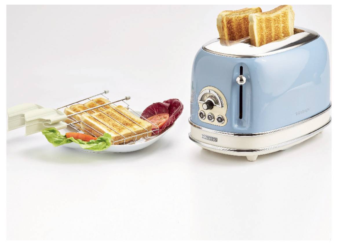 Blue toaster with two slices of toast and a metal rack beside a plate holding toasted bread and butter, showing bread toasting setup.
