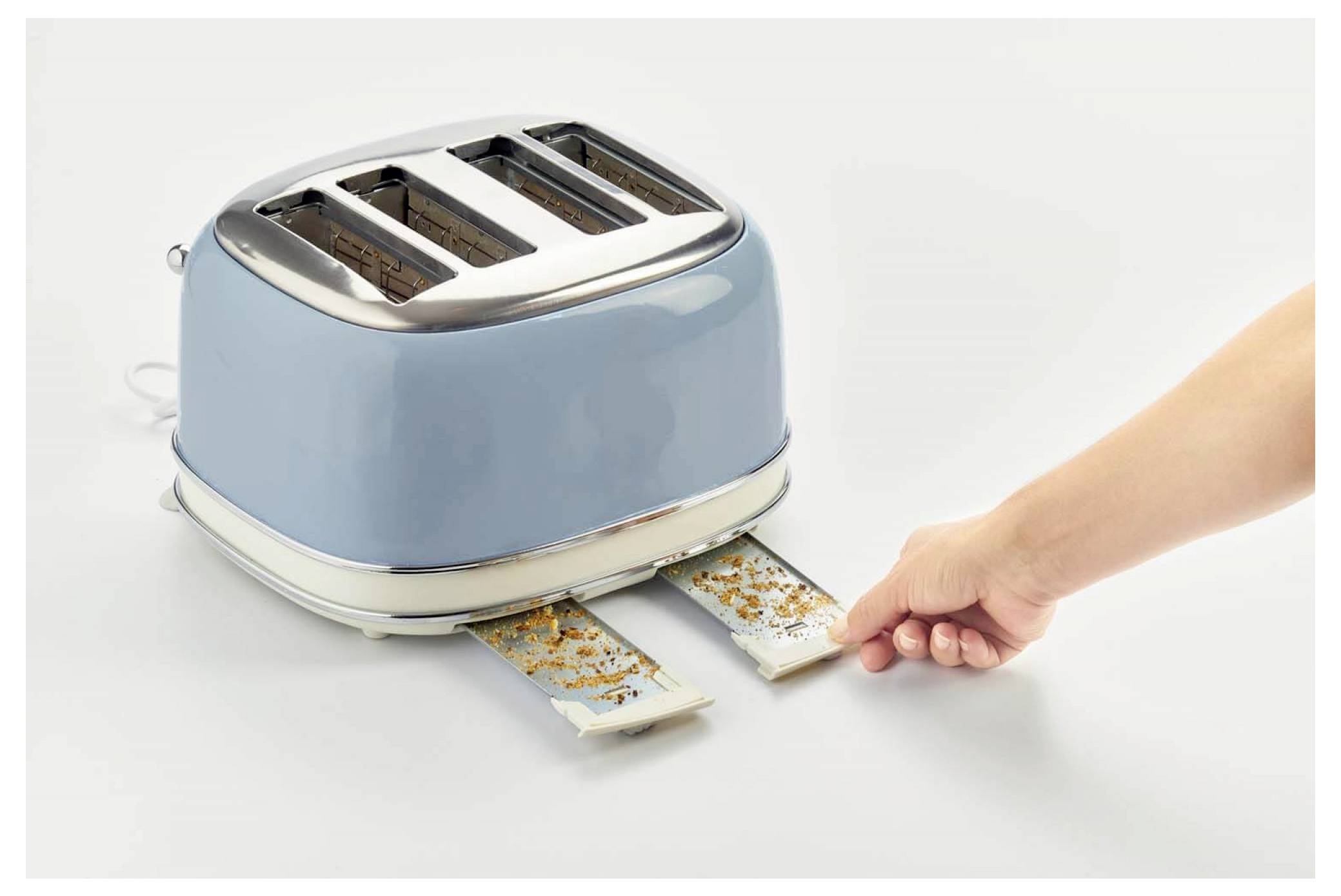 Hand pulling two burnt slices from a blue two-slot toaster on a white background.