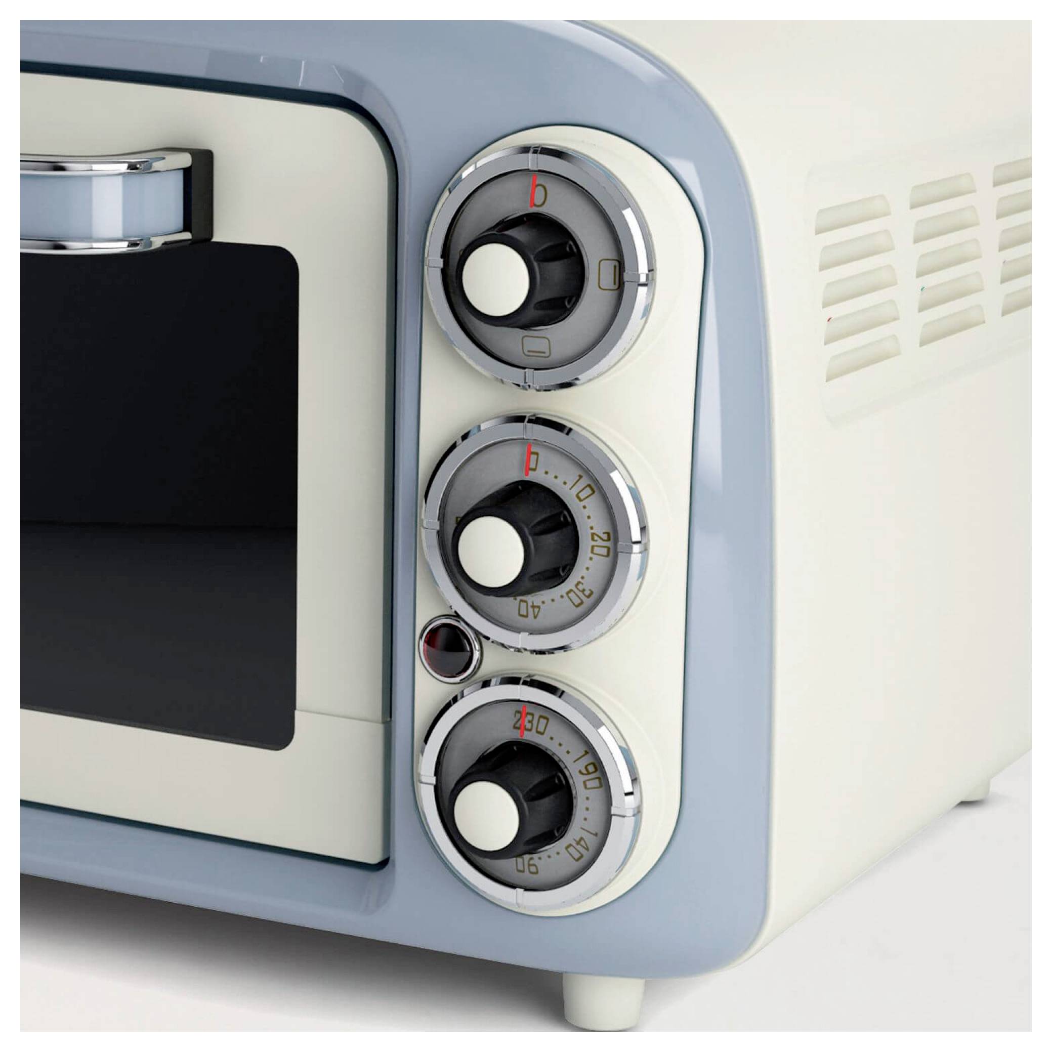 Close-up of a cream-and-blue retro appliance with three circular control dials on the right side.<br>