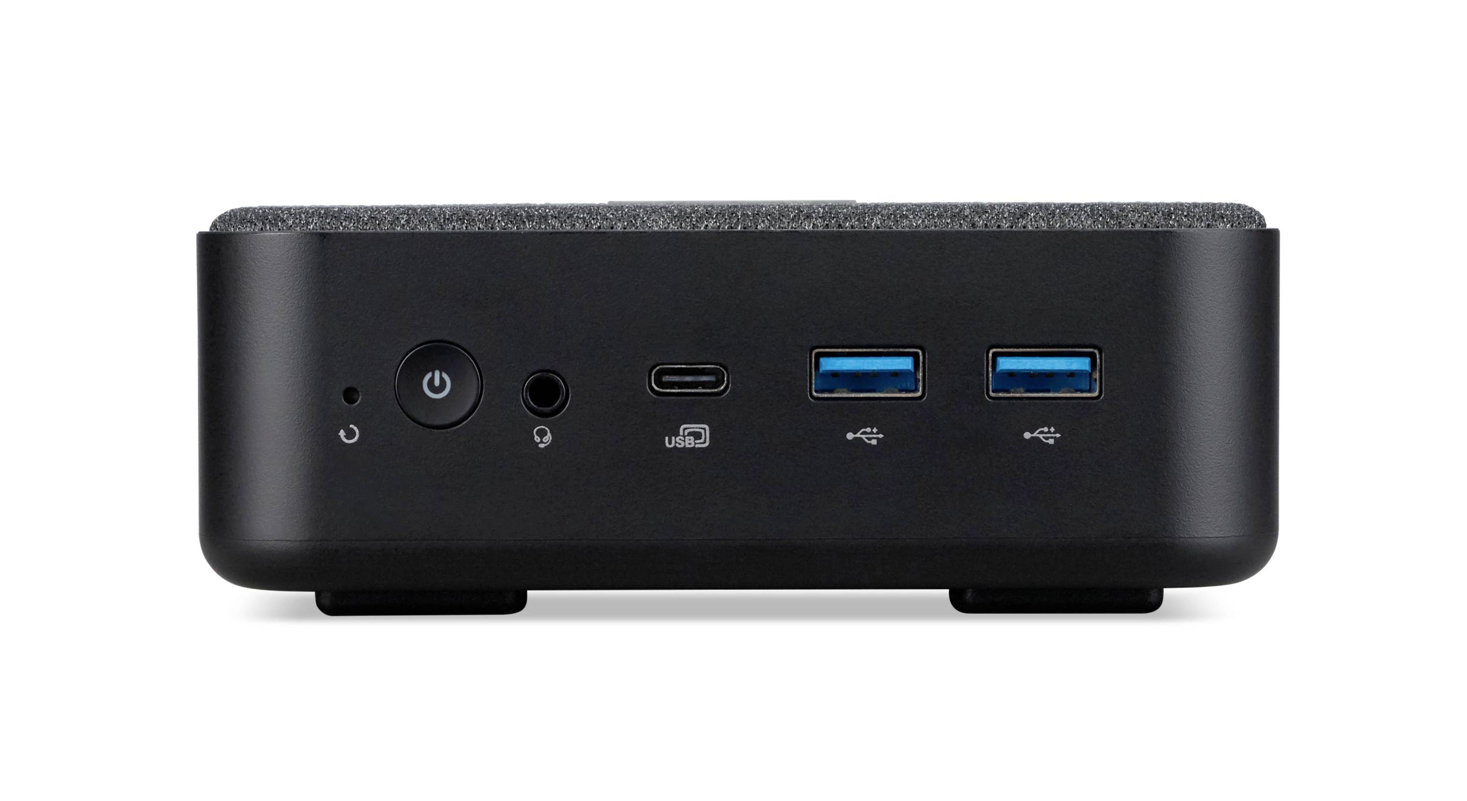 Front view of a small black mini PC with power button, audio jack, USB-C port, and two blue USB-A ports on the front panel.
