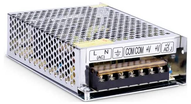 Metal enclosed power supply unit with perforated case and labeled terminal strip for AC, COM, and DC output connections.