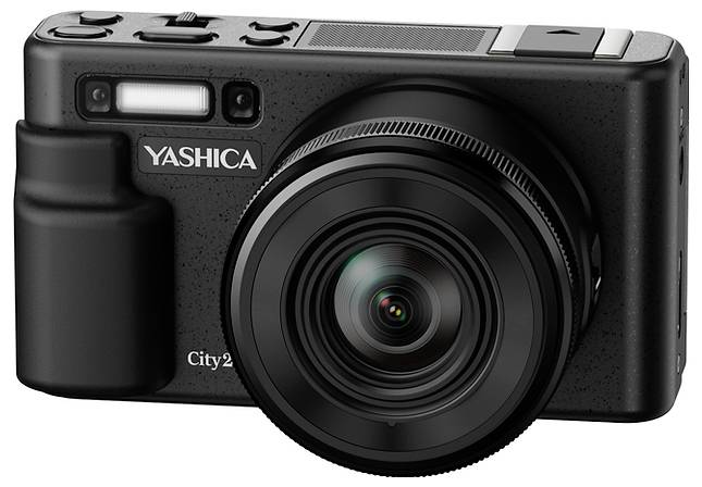 Black Yashica City 2 camera with large front lens and built-in flash, shown against a white background.