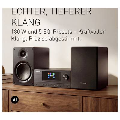 Panasonic stereo system with two speakers and display unit on a wooden cabinet, with German text promoting 'tighter, deeper sound' and 180W with 5 EQ presets.
